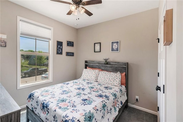 bedroom featuring carpet floors, baseboards, and a ceiling fan