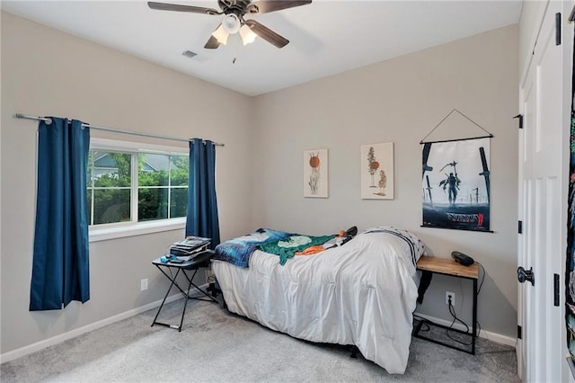 bedroom with carpet, baseboards, and ceiling fan