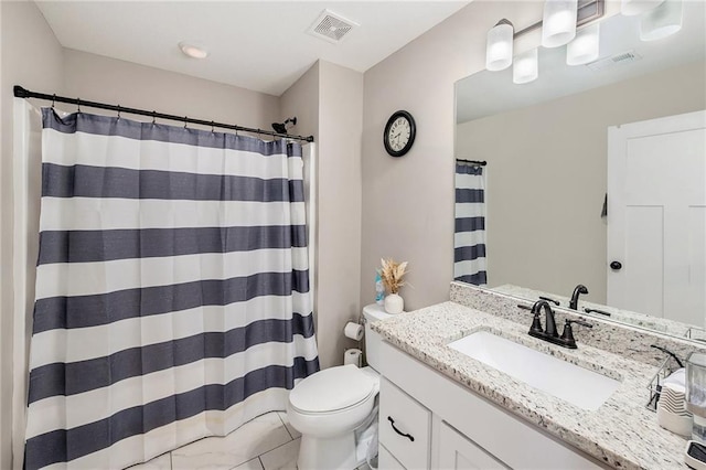 bathroom with toilet, vanity, and curtained shower