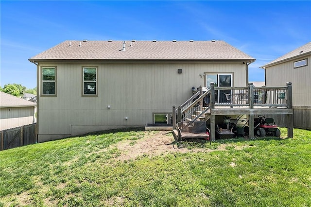 rear view of property with stairs, a wooden deck, and roof with shingles