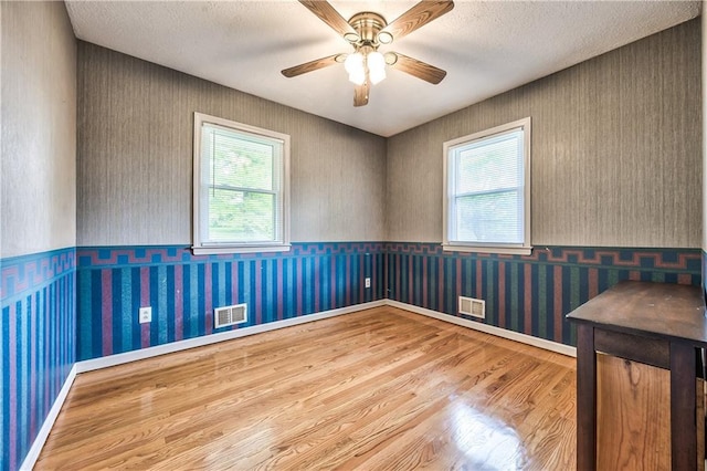 4328 S Brentwood St, Independence, MO 64055 - spare room with a wealth of natural light, wood finished floors, and visible vents