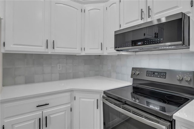 kitchen with light countertops, white cabinetry, tasteful backsplash, and stainless steel appliances