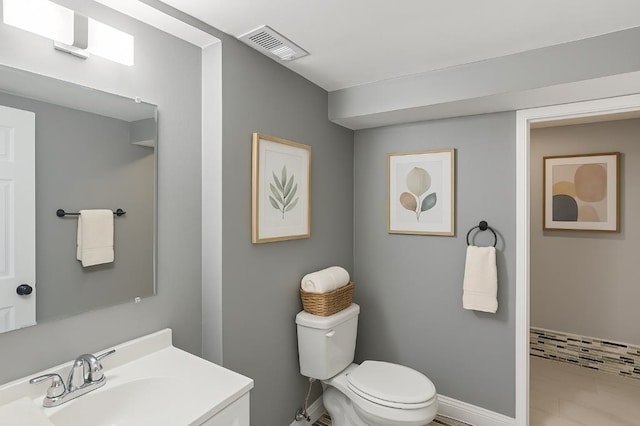 157 Clark Ave, Bonner Springs, KS 66012 - bathroom featuring toilet, vanity, and baseboards