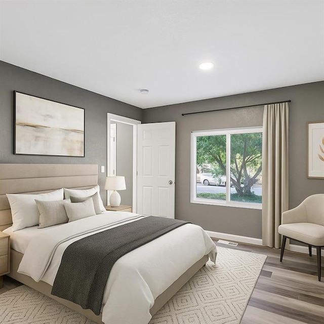 157 Clark Ave, Bonner Springs, KS 66012 - bedroom featuring light wood-type flooring, baseboards, and recessed lighting