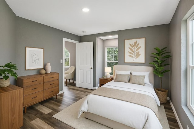 157 Clark Ave, Bonner Springs, KS 66012 - bedroom with dark wood-type flooring, baseboards, and recessed lighting