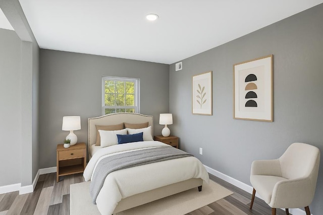 157 Clark Ave, Bonner Springs, KS 66012 - bedroom featuring baseboards, wood finished floors, and recessed lighting