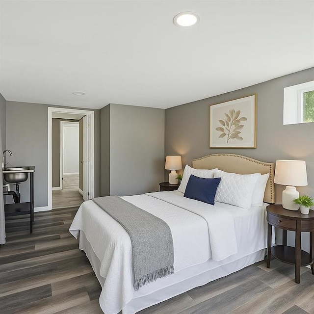 157 Clark Ave, Bonner Springs, KS 66012 - bedroom featuring wood finished floors, recessed lighting, and baseboards
