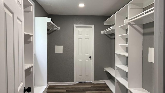157 Clark Ave, Bonner Springs, KS 66012 - walk in closet featuring dark wood finished floors