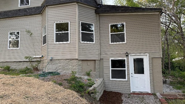 157 Clark Ave, Bonner Springs, KS 66012 - rear view of house featuring a shingled roof
