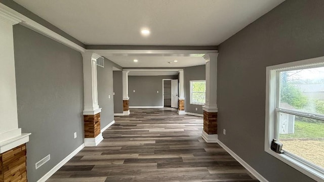 157 Clark Ave, Bonner Springs, KS 66012 - hall with decorative columns, dark wood-type flooring, baseboards, and recessed lighting