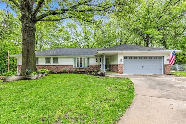 8739 Lafayette Ave, Kansas City, KS 66109 - single story home featuring brick siding, driveway, an attached garage, and french doors