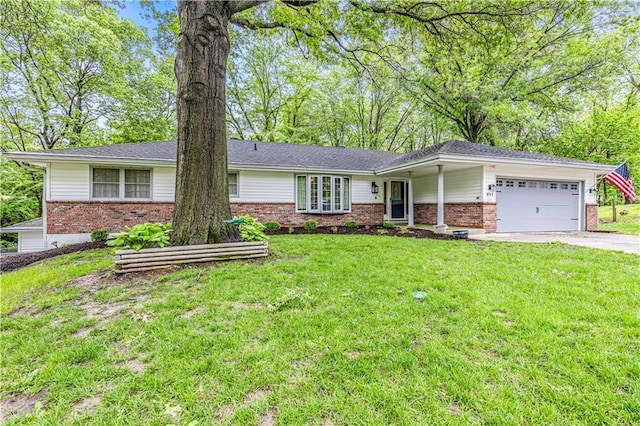 8739 Lafayette Ave, Kansas City, KS 66109 - view of front facade featuring brick siding, an attached garage, concrete driveway, and a front lawn