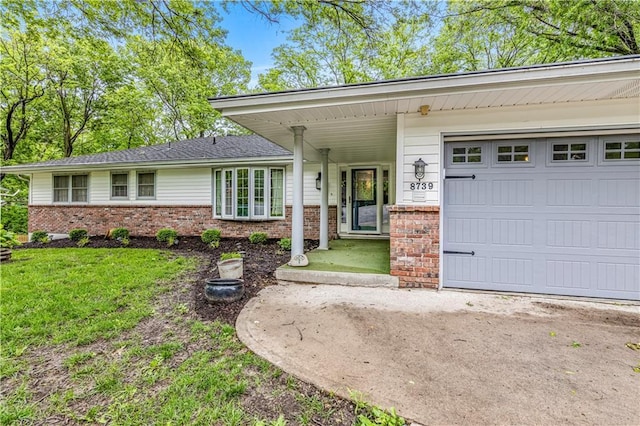 8739 Lafayette Ave, Kansas City, KS 66109 - single story home featuring brick siding, a garage, and a front yard
