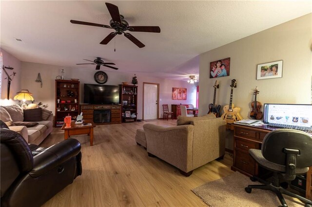 403 S 2nd St, Drexel, MO 64742 - living area with a ceiling fan, light wood-style flooring, and visible vents