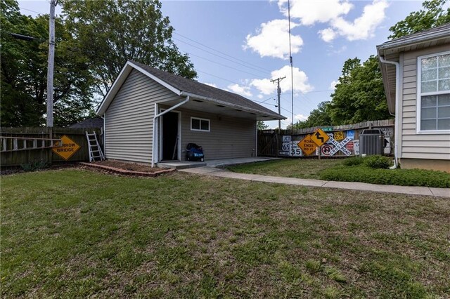 403 S 2nd St, Drexel, MO 64742 - rear view of property featuring a fenced backyard, central air condition unit, and a yard