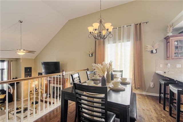 5912 NE Hidden Valley Dr, Lees Summit, MO 64064 - dining area featuring vaulted ceiling, a chandelier, wood finished floors, ceiling fan, and baseboards