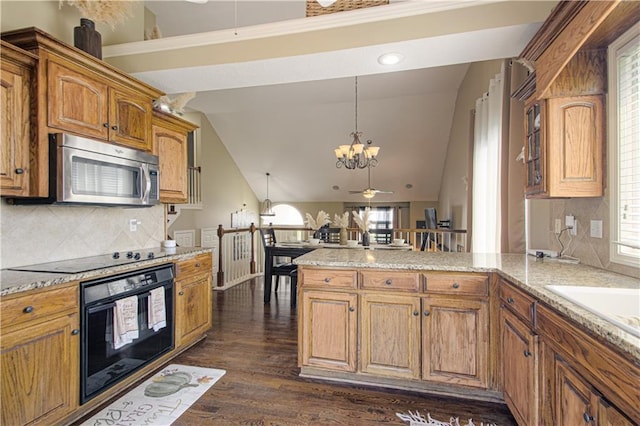 5912 NE Hidden Valley Dr, Lees Summit, MO 64064 - kitchen with black appliances, a chandelier, a peninsula, a ceiling fan, and brown cabinets