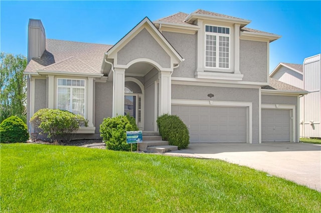 5912 NE Hidden Valley Dr, Lees Summit, MO 64064 - view of front of property with a front lawn, driveway, a chimney, and stucco siding