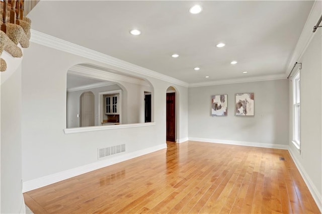 9000 W 104th St, Overland Park, KS 66212 - unfurnished living room with visible vents, crown molding, baseboards, light wood-style floors, and recessed lighting