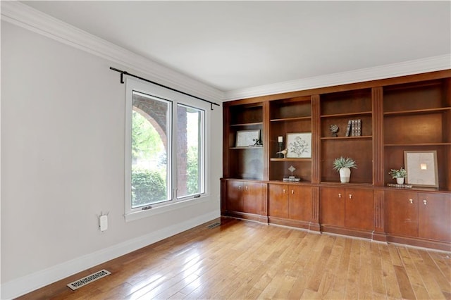 9000 W 104th St, Overland Park, KS 66212 - empty room featuring crown molding, baseboards, visible vents, and light wood-style flooring