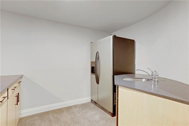 9000 W 104th St, Overland Park, KS 66212 - kitchen featuring baseboards, refrigerator with ice dispenser, light colored carpet, and a sink