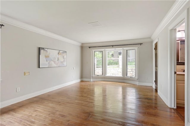 9000 W 104th St, Overland Park, KS 66212 - unfurnished room featuring crown molding, baseboards, and hardwood / wood-style flooring