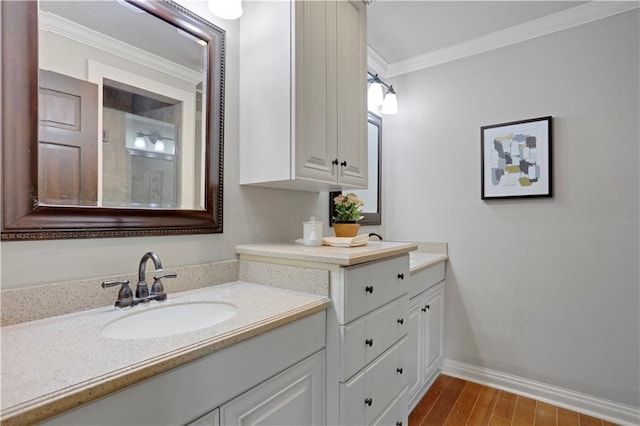 9000 W 104th St, Overland Park, KS 66212 - bathroom featuring baseboards, ornamental molding, vanity, and wood finished floors