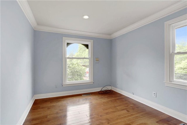 9000 W 104th St, Overland Park, KS 66212 - spare room with visible vents, wood-type flooring, crown molding, and baseboards
