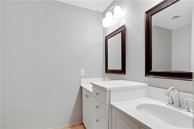 9000 W 104th St, Overland Park, KS 66212 - bathroom with baseboards, visible vents, and vanity