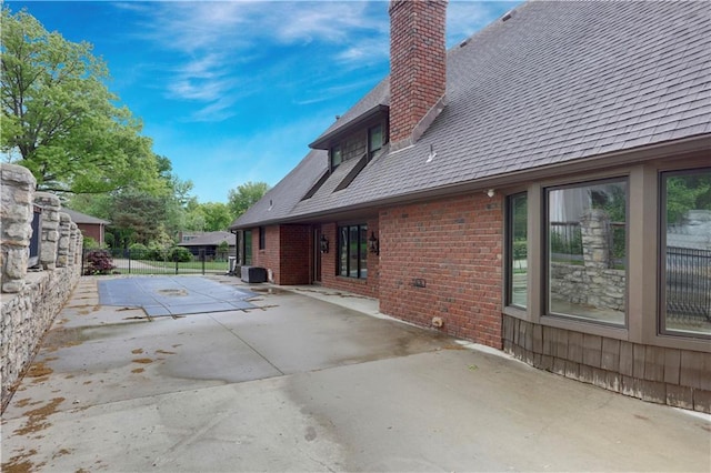 9000 W 104th St, Overland Park, KS 66212 - view of pool featuring a patio and central AC unit