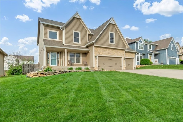 view of front facade with fence, driveway, a front lawn, and a garage