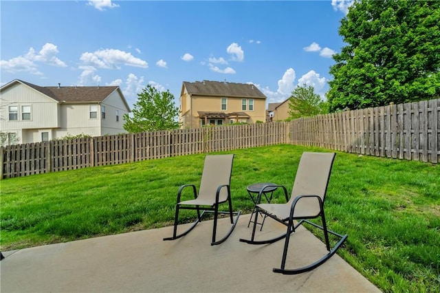 view of patio / terrace with a fenced backyard and a residential view
