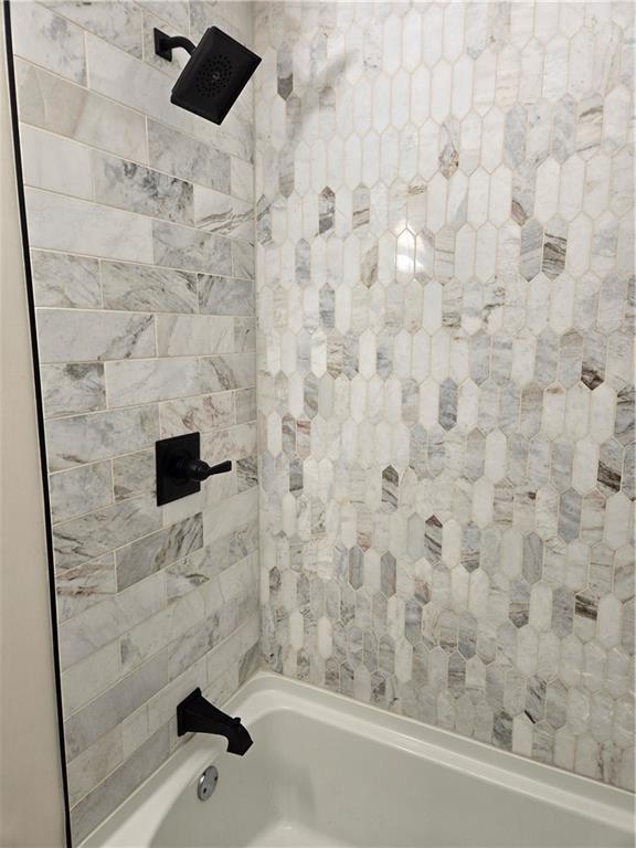 606 W Red Bridge Rd, Kansas City, MO 64114 - bathroom featuring shower / washtub combination