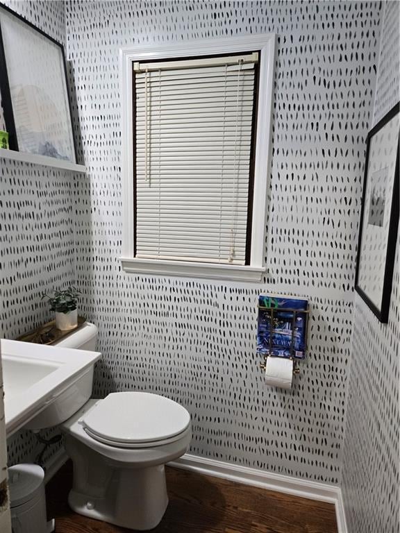 606 W Red Bridge Rd, Kansas City, MO 64114 - bathroom with wood finished floors, toilet, and wallpapered walls