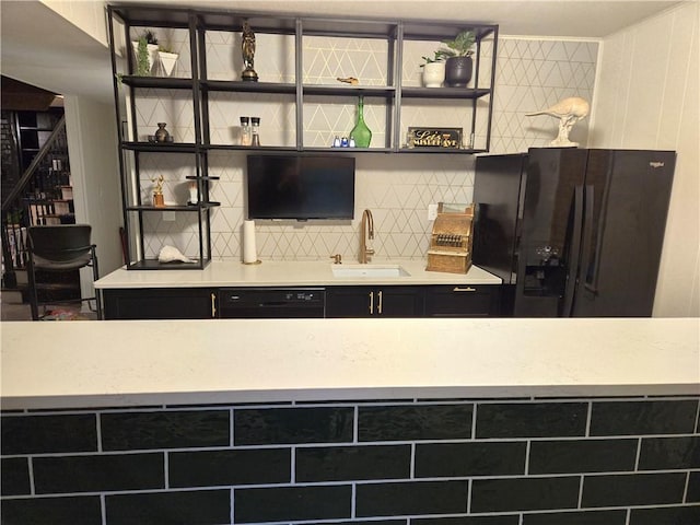 606 W Red Bridge Rd, Kansas City, MO 64114 - kitchen featuring black appliances, a sink, open shelves, light countertops, and backsplash