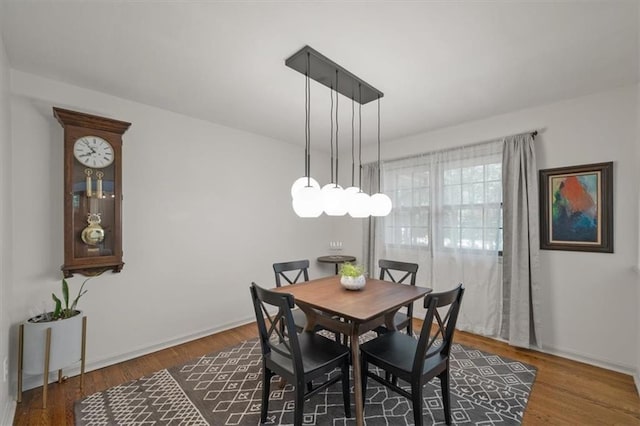 606 W Red Bridge Rd, Kansas City, MO 64114 - dining space featuring wood finished floors and baseboards