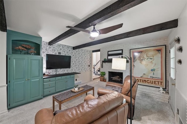 606 W Red Bridge Rd, Kansas City, MO 64114 - living room with light carpet, a fireplace, beamed ceiling, wallpapered walls, and ceiling fan