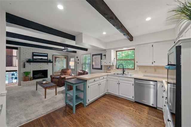 606 W Red Bridge Rd, Kansas City, MO 64114 - kitchen featuring dishwasher, a peninsula, beam ceiling, open floor plan, and white cabinetry