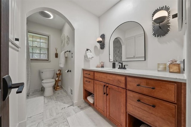 606 W Red Bridge Rd, Kansas City, MO 64114 - bathroom with vanity and toilet