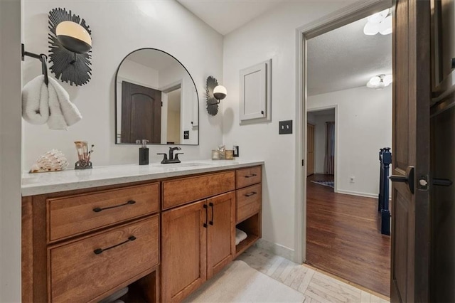 606 W Red Bridge Rd, Kansas City, MO 64114 - bathroom featuring wood finished floors and vanity