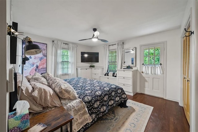 606 W Red Bridge Rd, Kansas City, MO 64114 - bedroom with dark wood-type flooring and a ceiling fan