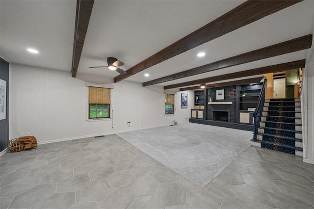 606 W Red Bridge Rd, Kansas City, MO 64114 - unfurnished living room with a brick fireplace, stairs, a ceiling fan, beamed ceiling, and recessed lighting