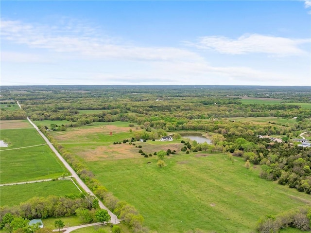 birds eye view of property with a water view and a rural view