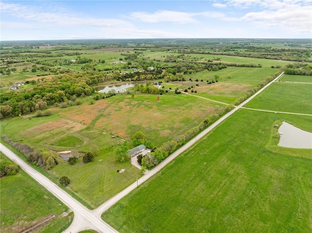 aerial view featuring a water view and a rural view