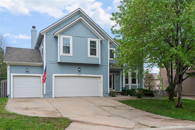view of front of house with fence, an attached garage, a chimney, and driveway