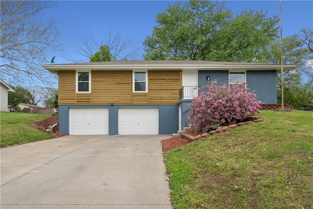  - view of front of property with concrete driveway, a front lawn, and a garage