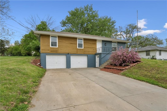  - view of front of home with stairs, a garage, a front lawn, and concrete driveway