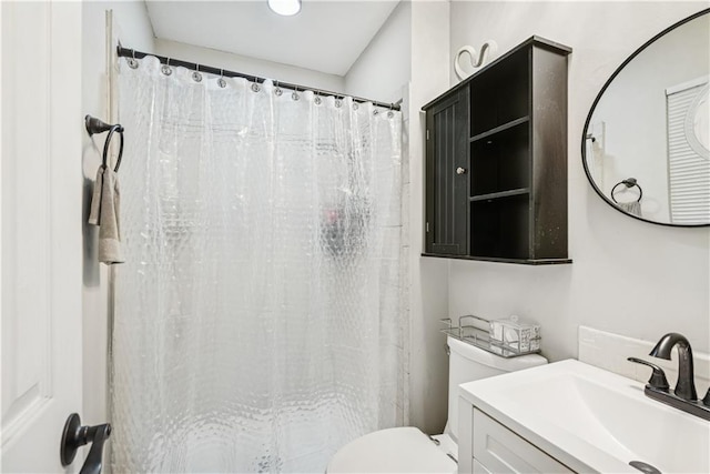  - full bathroom with vanity, toilet, and a shower with shower curtain