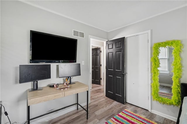  - interior space featuring visible vents and wood finished floors