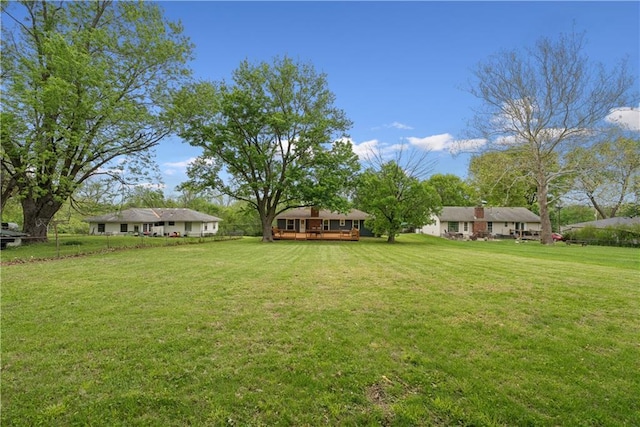  - view of yard with a wooden deck